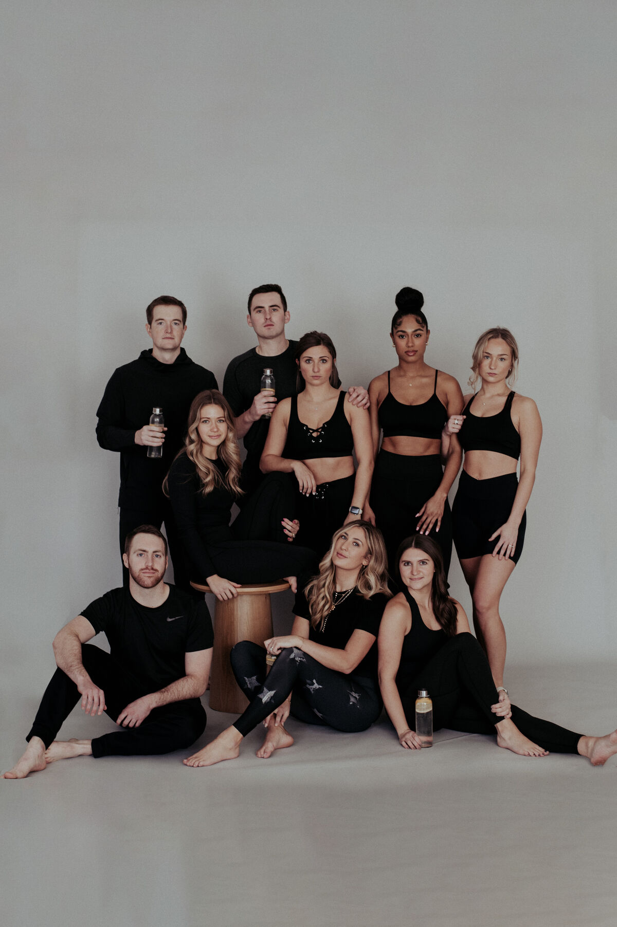 group in all black sitting